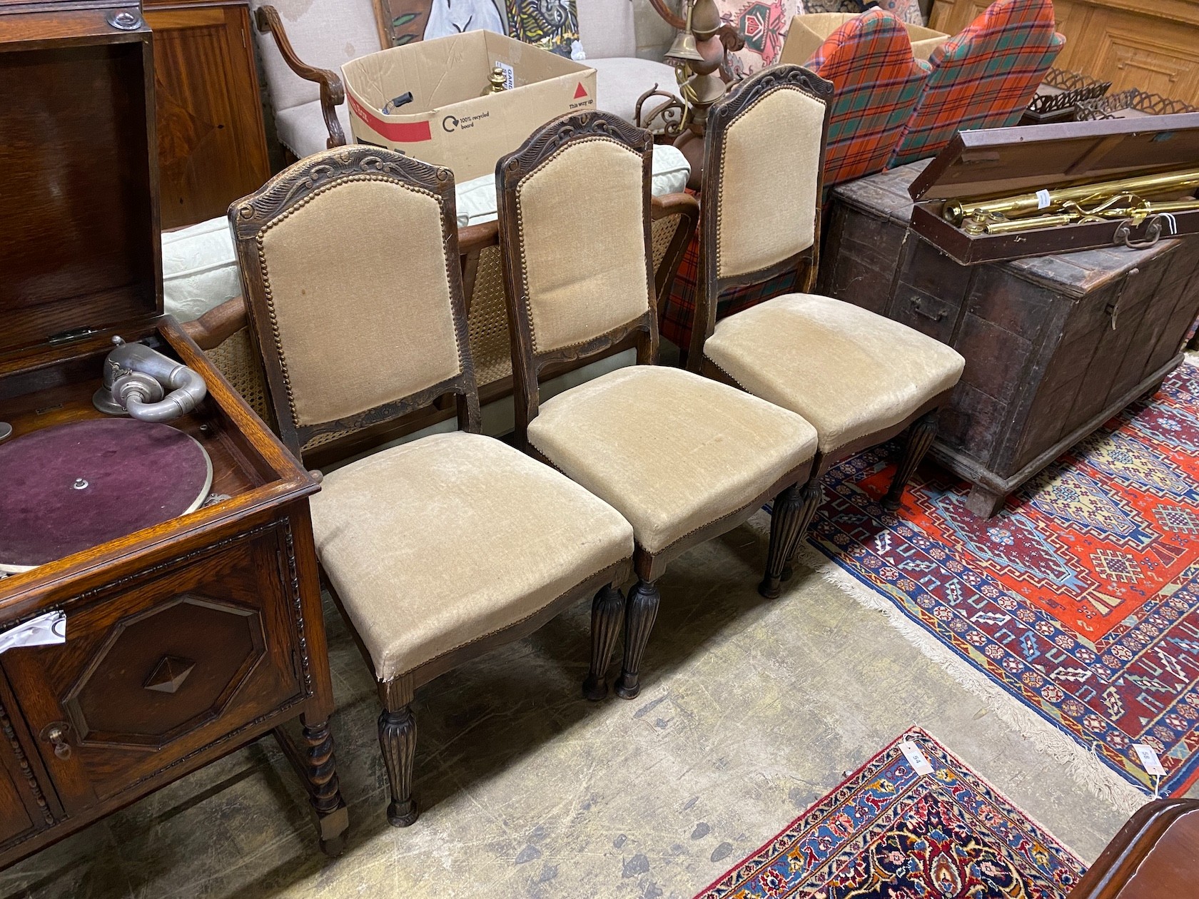 Three continental oak dining chairs.